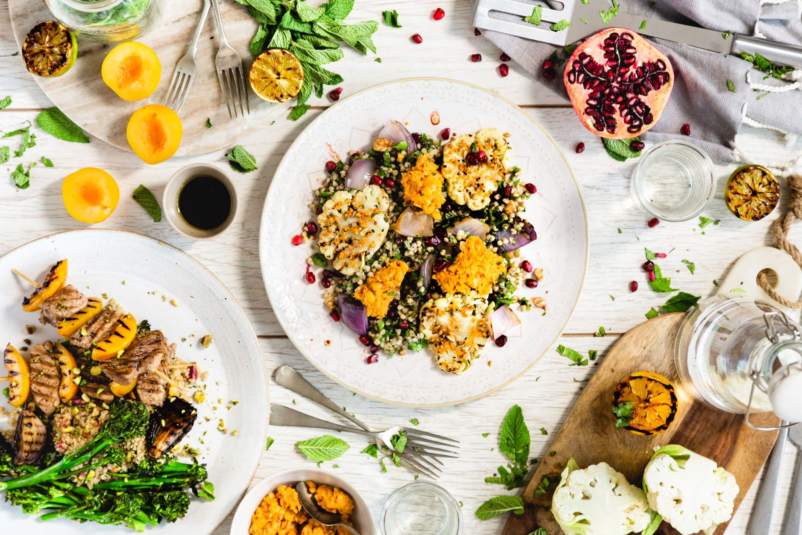 Cauliflower steaks, harissa hummus & walnuts