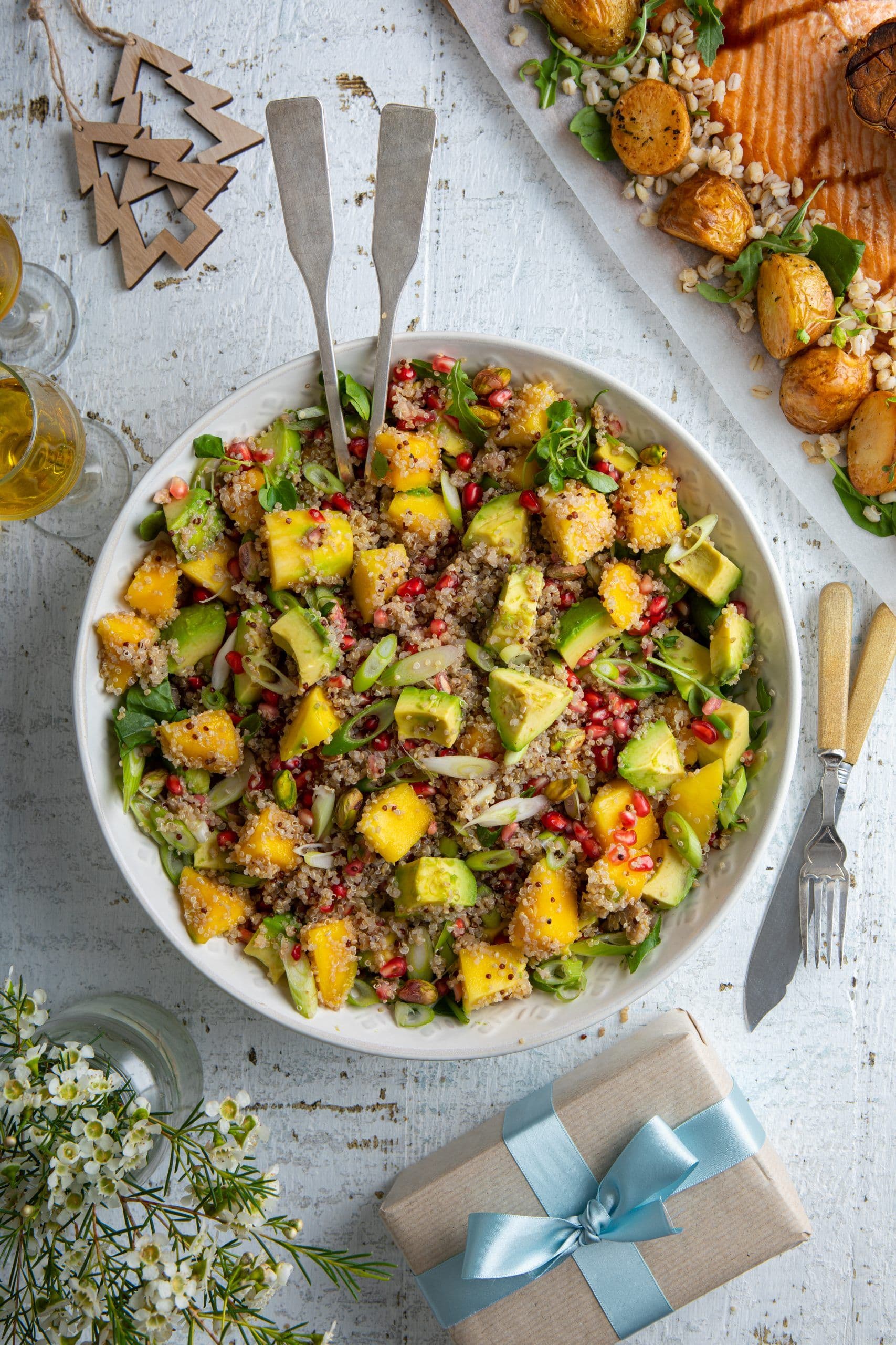 Warm quinoa salad with avocado, mango and pomegranate