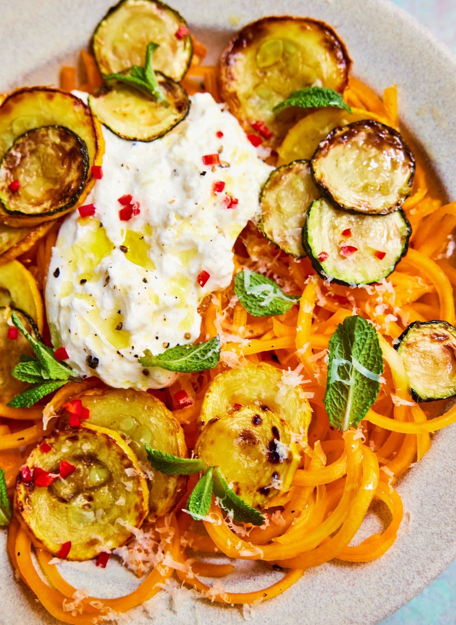 Butternut squash spaghetti with fried courgette, mint and lemon zest
