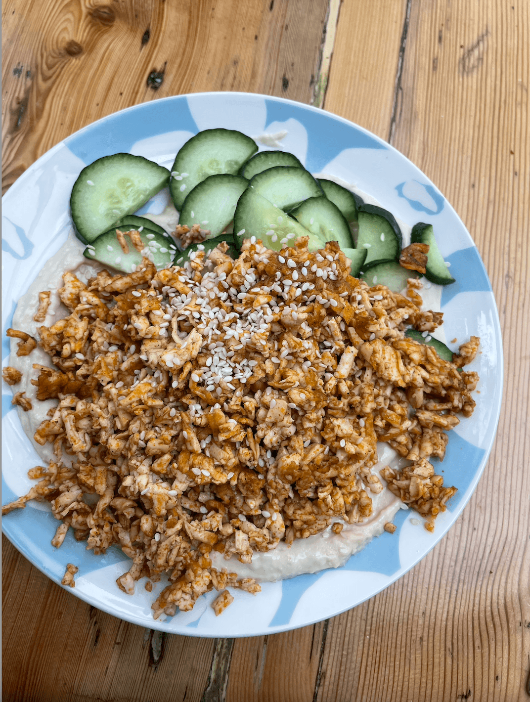 Stir fried tofu, humus bed & cucumbers