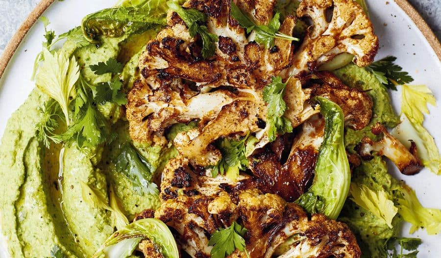 Fried chermoula cauliflower on herby bean dip with slaw