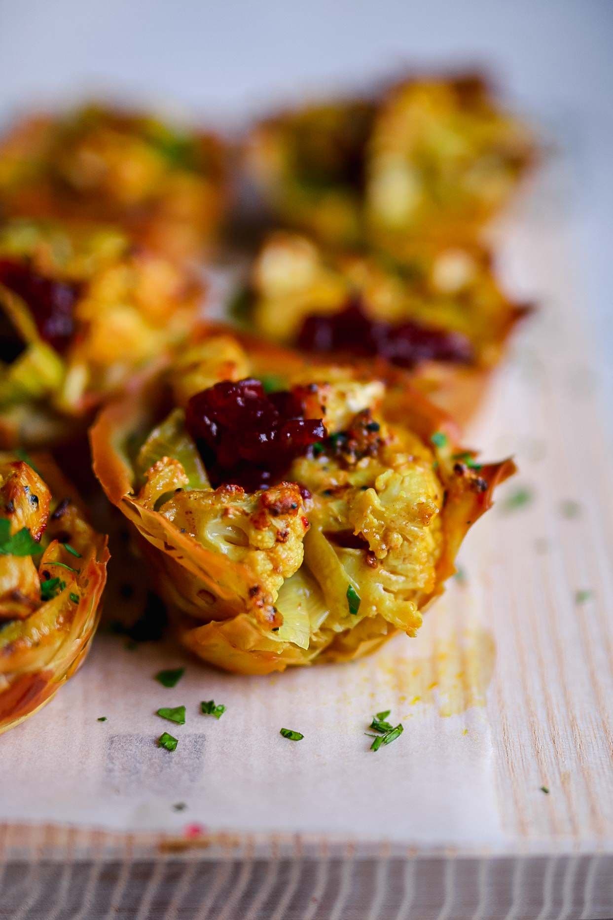 Curried cheesy cauliflower and leek filo tarts with cranberry sauce